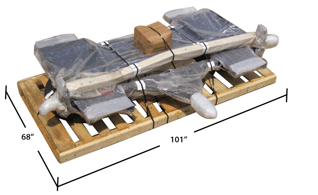Tow dolly pallet being handled by forklift inside freight terminal warehouse ready for nationwide shipping